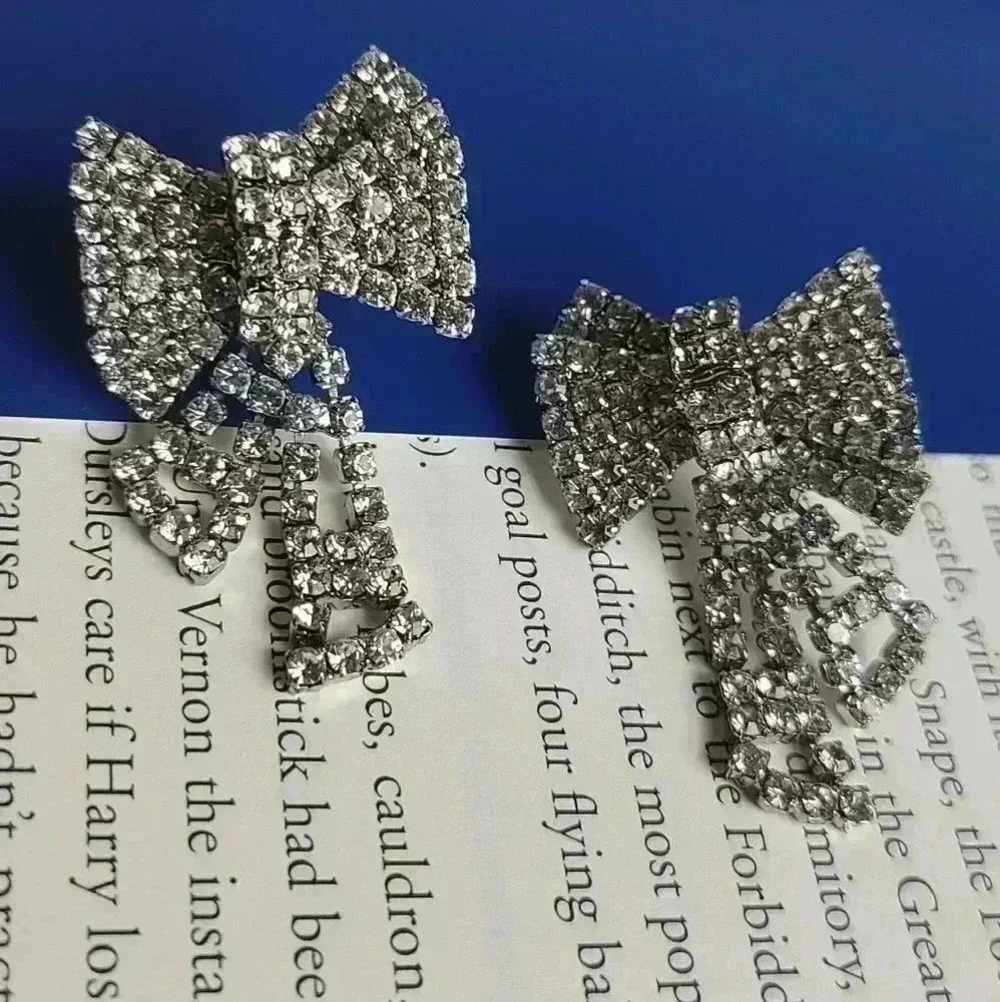 Silver tone clear rhinestones bow earrings - Picture 9 of 17